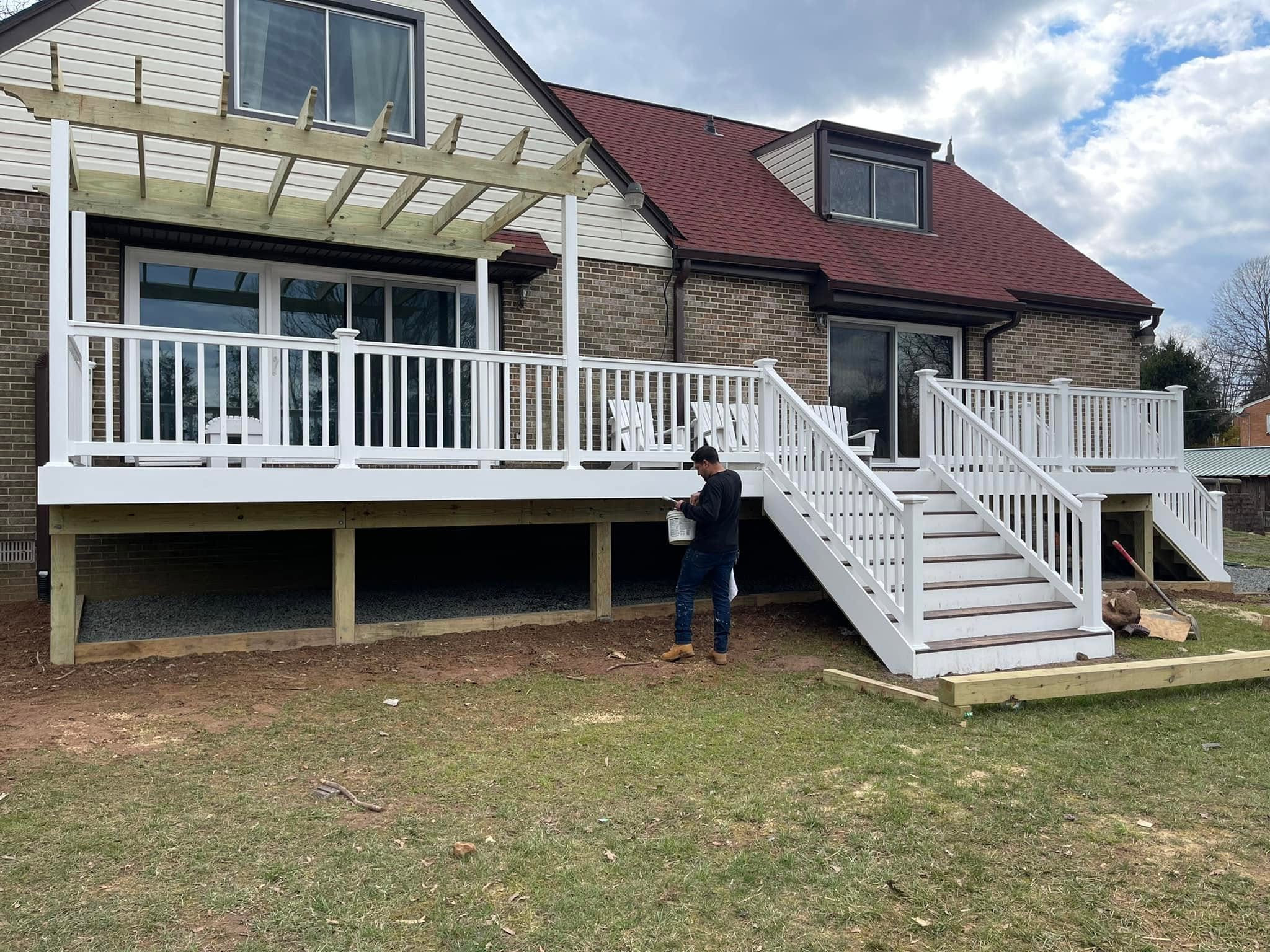E.T. General Contractor crew member working on a two-story deck project in Northern Virginia
