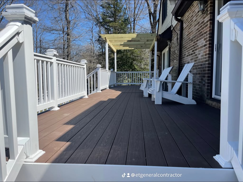 Composite deck with white railing and pergola built by E.T. General Contractor