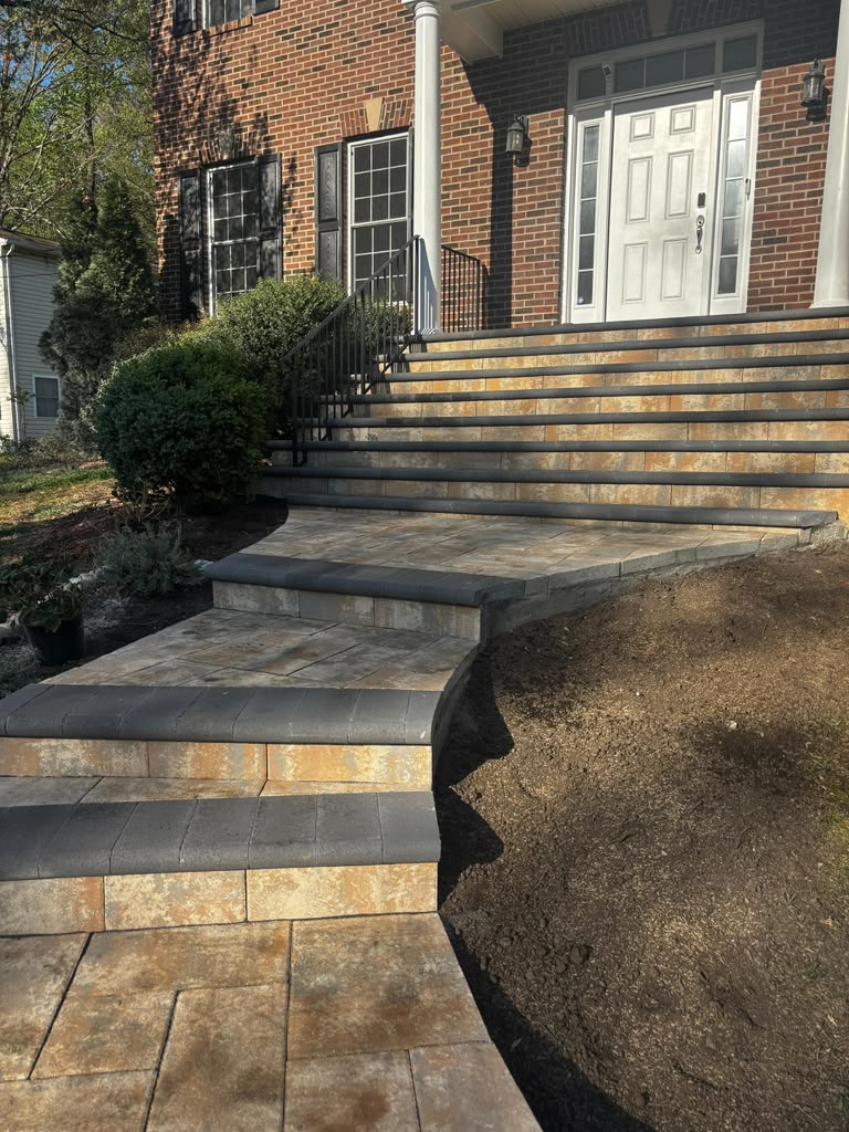 Front entry paver steps and landing built by E.T. General Contractor