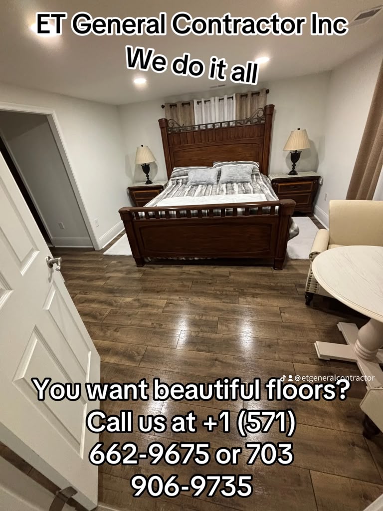 New laminate flooring installed in a finished bedroom by E.T. General Contractor in Northern Virginia